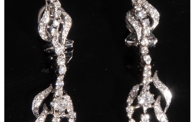 A pair of diamond pedant earrings, each set with forty five ...