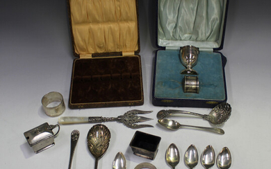 A pair of late Victorian silver serving spoons, each bowl with bright cut engraved floral decoration