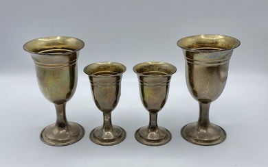 A pair of sterling silver goblets together with a...