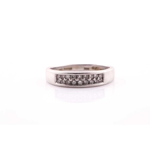 A platinum and diamond ring, the shank pave-set with eightee...