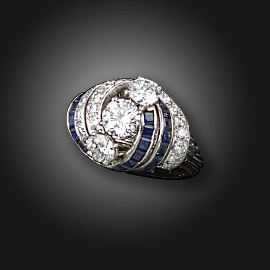 A sapphire and diamond cluster ring, Monture Cartier, set with...