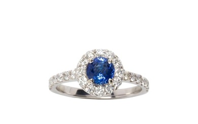 A sapphire, diamond 14k white gold ring