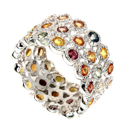 A sapphire ring set with numerous circular-cut multicoloured sapphires, mounted in rhodium plated sterling silver. Size 57.
