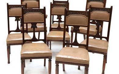 A set of eight Art Nouveau walnut dining chairs