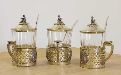 A set of three Russian silver gilt tea glass holders