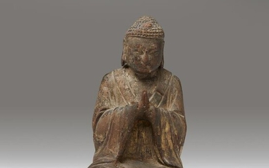 A small Chinese gilt lacquered wood figure of a seated