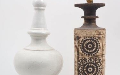 A studio pottery lamp base, 20th century, decorated with impressed geometric motifs in three double panels, with impressed mark for Quantock Pottery at base, 48cm high excluding electrical fittings, together with a white glazed bulbous column...