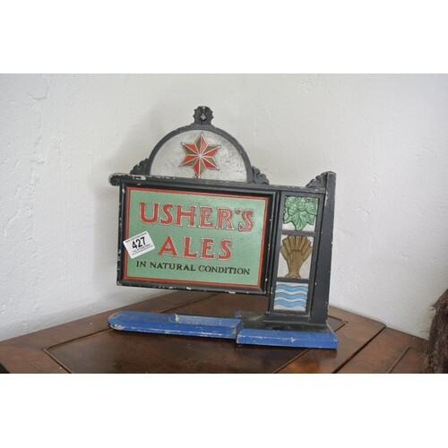 A vintage cast iron Ushers Ales sign.