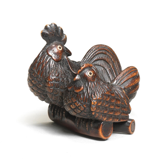 A wood netsuke of a cock and hen