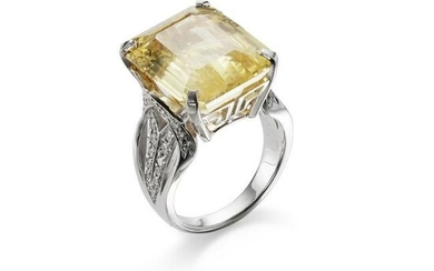 A yellow sapphire and diamond ring