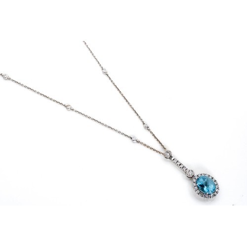 AN AQUAMARINE AND DIAMOND PENDANT NECKLACE, BROWNS