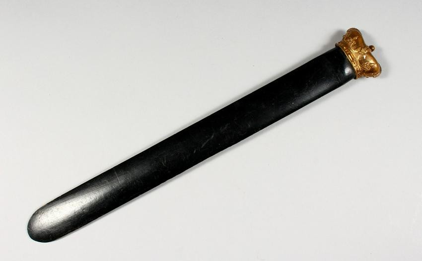 AN EBONISED PAGE TURNER, with crown finial. 14ins