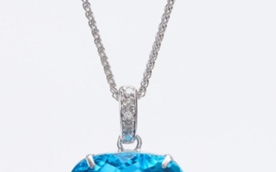 AN IMPRESSIVE TOPAZ PENDANT-The cushion cut blue topaz weighing 100cts, to a diamond set bale, suspended from a fine trace chain, al...
