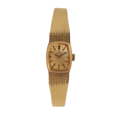 AN OMEGA 18CT GOLD LADY'S BRACELET WATCH with manual wind m...