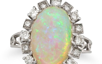 AN OPAL AND DIAMOND CLUSTER RING set with an oval cabochon opal in a cluster of round brilliant cut