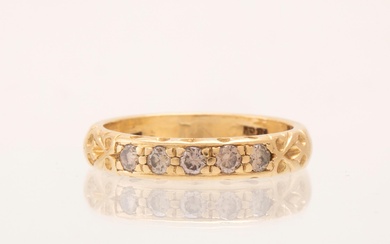 An 18K gold half-eternity ring set with round brilliant-cut diamonds