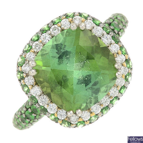 An 18ct gold green tourmaline dress ring, with brilliant-cut diamond and pave-set diamond surround and shoulders.
