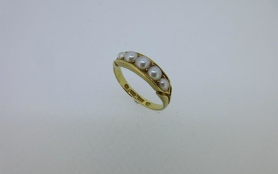 An 18ct gold pearl set ring