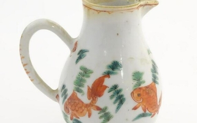 An 18thC Chinese jug with a sparrow beak, decorated
