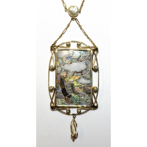 An Arts & Crafts pendant in the manner of Archibald Knox...