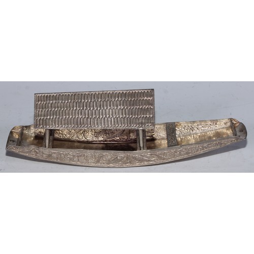 An Indian silver model, of a boat, the side chased with fish...