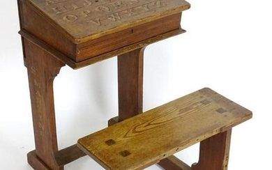 An early 20thC school desk and seat with a liftable