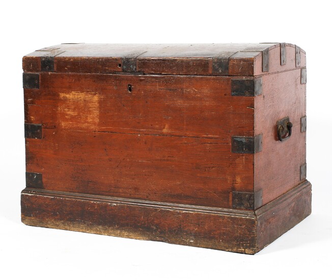 An early Victorian domed top iron-bound trunk on plinth base