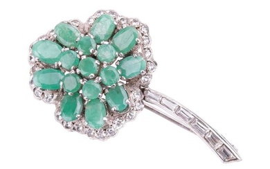 An emerald-set shamrock brooch, the oval mixed-cut emeralds centrally set in a trefoil pattern, surr