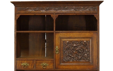 Arthur W. Simpson (1857-1922), an Arts and Crafts carved oak...