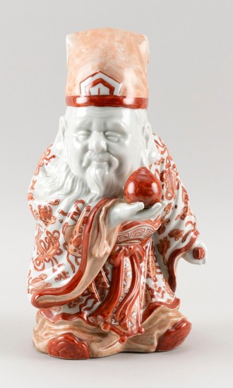 CHINESE PORCELAIN FIGURE OF SHOU-LAO In orange and white robes and holding a peach and a scepter. Height 11".