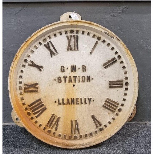 Cast iron railway clock face with Roman numerals, marked GWR...