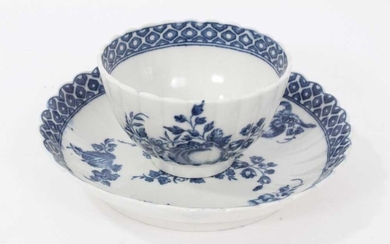 Caughley tea bowl and saucer, circa 1780, of fluted form, printed in blue with the 'Apple' pattern, the saucer measuring 12.75cm diameter