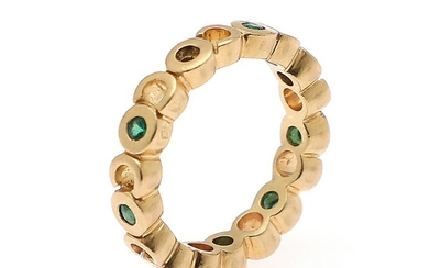 Chanel: An emerald ring set with numerous circular-cut emeralds, mounted in 18k gold. Size 54.