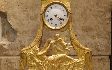 Clock in chased and gilded bronze with decoration...