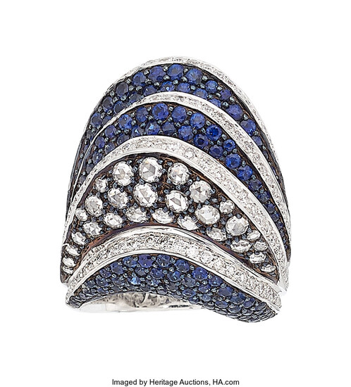 Diamond, Sapphire, White Gold Ring The ring features round-cut...