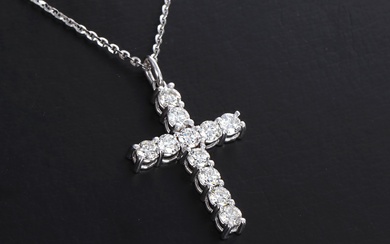 Diamond cross pendant in chain of 18 kt. white gold, 0.69 ct. (2)