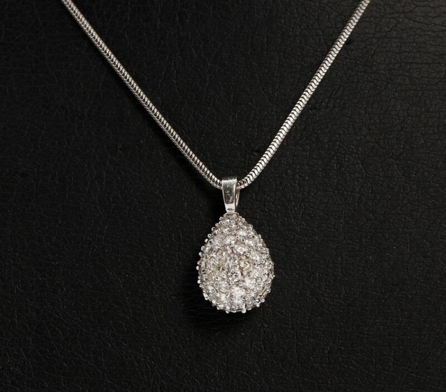 Diamond pendant set with numerous brilliant-cut diamonds, mounted in 18k white gold. A 14k white gold necklace included. Pendant L. 2.2 cm. 2008.