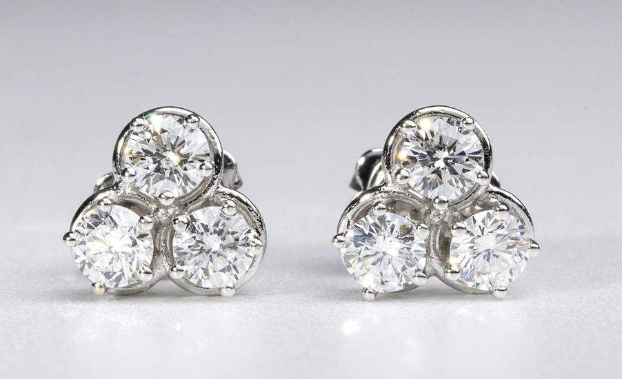 Diamonds gold earrings 18k white gold, each set with ...