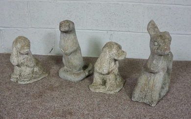 Four composition stone garden ornaments, including an otter, two spaniels and a faun (4)