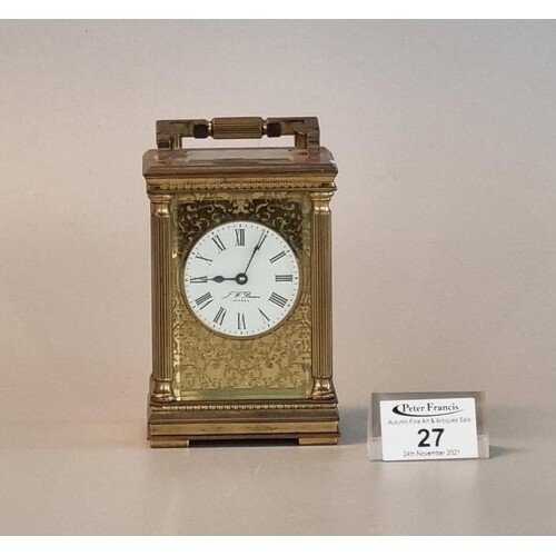 French gilt brass carriage clock with gilded face around whi...