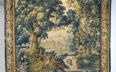 Important Aubusson tapestry in wool and silk with "Dromedary, parrot and wader in a greenery at the river against the backdrop of the landscape at the castle". Bearing the signature of the lissier at the bottom right PH. Aubusson. Mantling border...