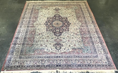 Indo-Persian Wool Carpet, with blue medallion & pendants on a cream field with pink highlights(257 x 313cm)