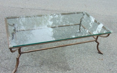 Large glass top, iron base coffee or cocktail table, top is 60" by 31.75", height is 18.5"