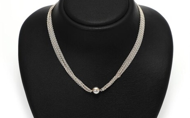 SOLD. Ole Lynggaard: A 14k gold and white gold "Smile" clasp with a satin finish. Diam. 9.5 mm. And a five strand sterling silver necklace. Total l. 42 cm. (2) – Bruun Rasmussen Auctioneers of Fine Art