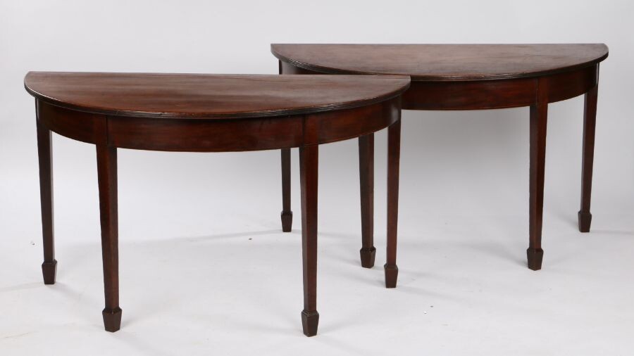 Pair of George III mahogany side tables, the demi lune tables with a reeded edge above square