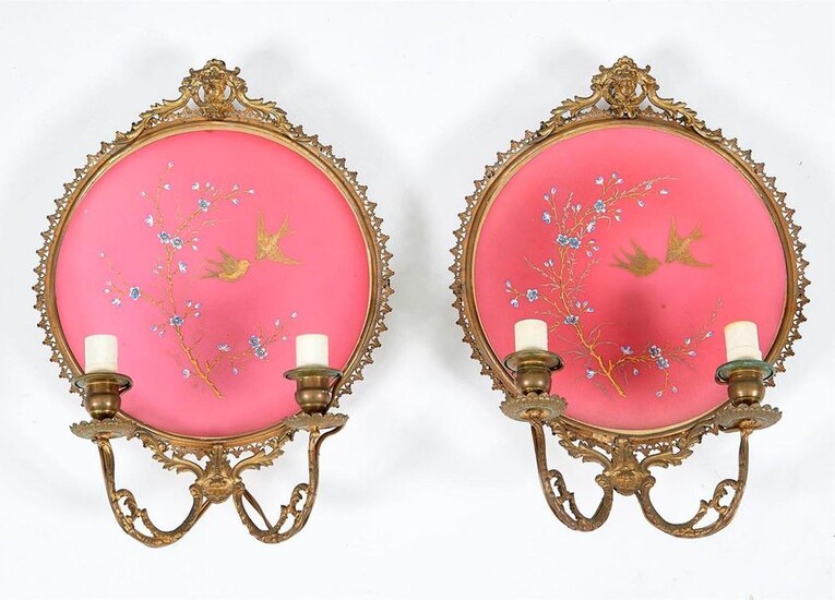 Pair of L.XVI style sconces in gilt bronze and pink opaline. Reflectors decorated with birds and plum tree branches. Late 19th century period. Total height 37.5 cm.