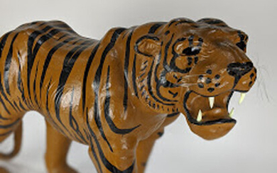 Papier mache figure of a walking tiger