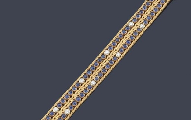 Semi-rigid bracelet with a braided design in 18K yellow