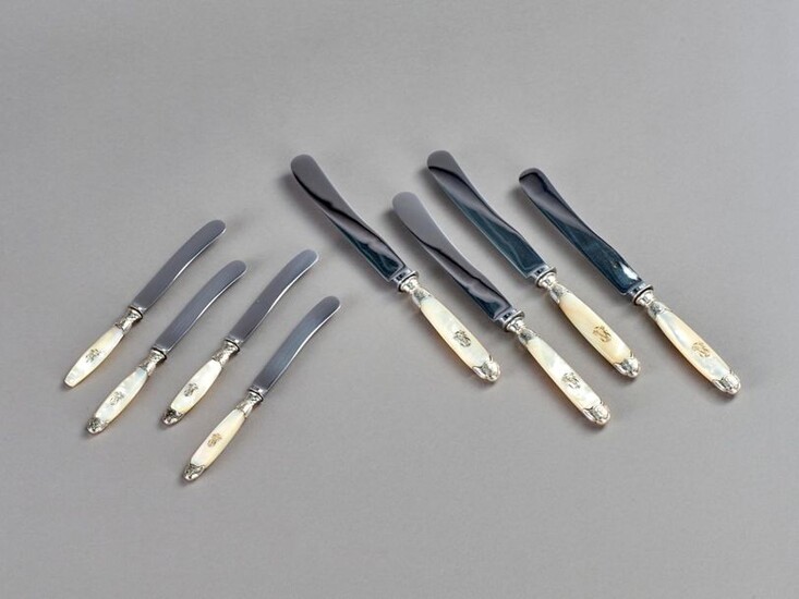 Set of 12 large and 12 small knives with steel blades and mother-of-pearl handles engraved with a number and silver ferrules.