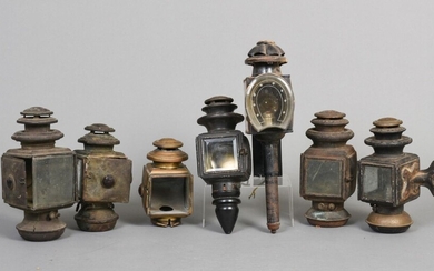 Seven Antique Auto Lamps.